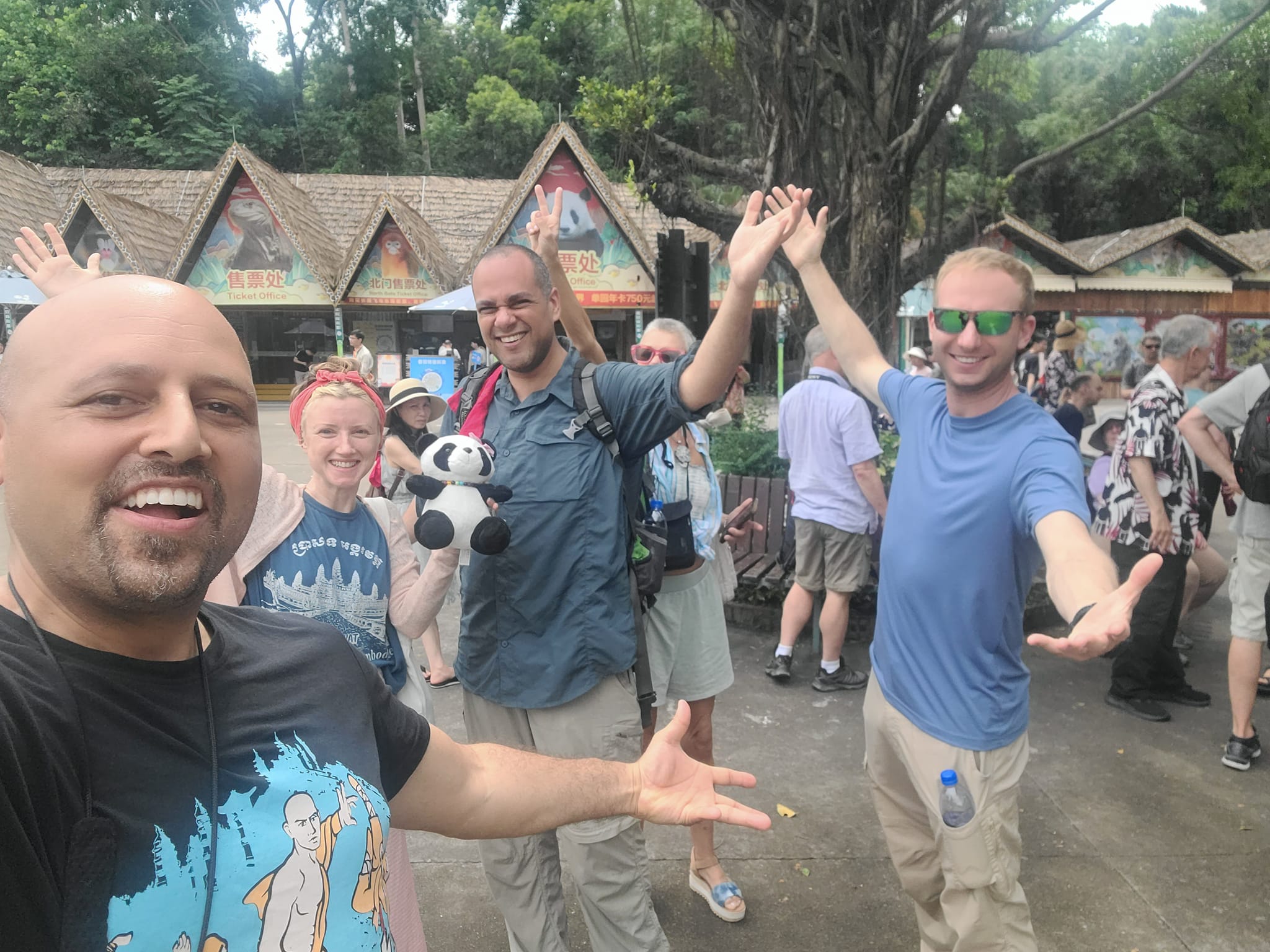 At the China zoo entrance with a bunch of friends as part of our Panda Themed Shaolin China Trip